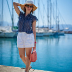 blue shirt, white shorts in Agios Nikolaos Crete