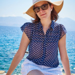 blue shirt, white shorts in Agios Nikolaos Crete