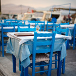 Tables by the sea in Elafonisos port, Greece