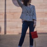 Louis Vuitton red clutch, grey jacket and Call it Spring beige boots