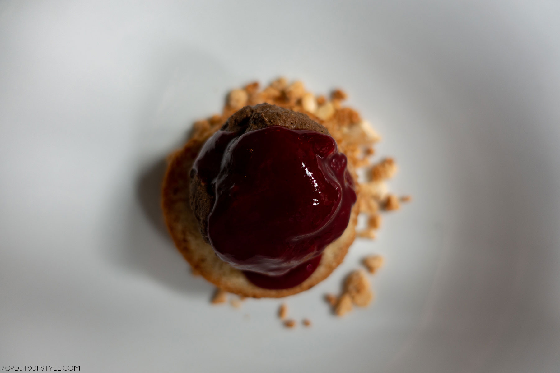 dessert with raspberry sauce, chocolate parfait and hazelnut cake