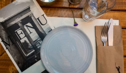 Ergon House restaurant menu, plate, glass and cutlery