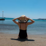 girl sitting on the beach Platis Gialos Sifnos