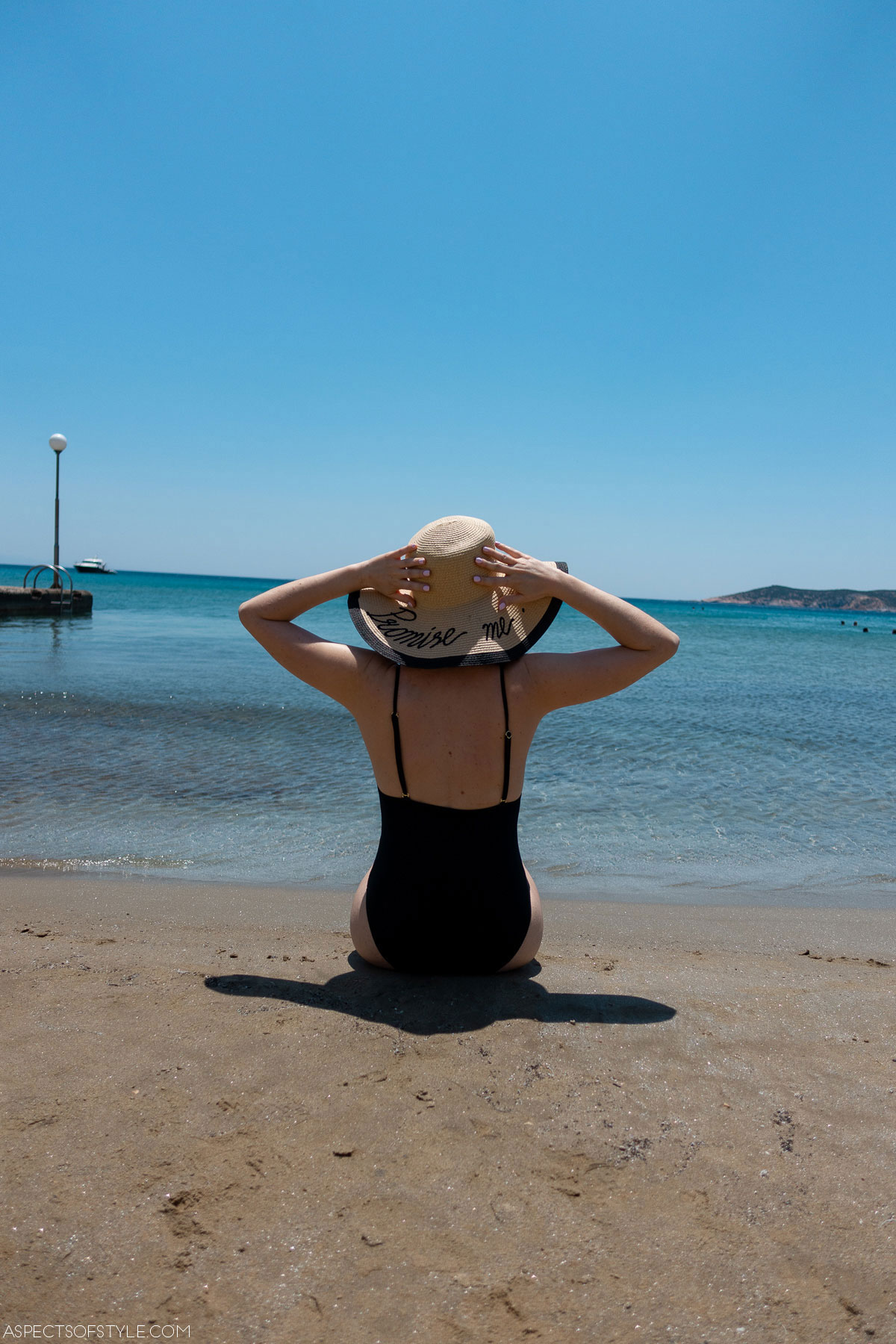 girl sitting on the beach Platis Gialos Sifnos