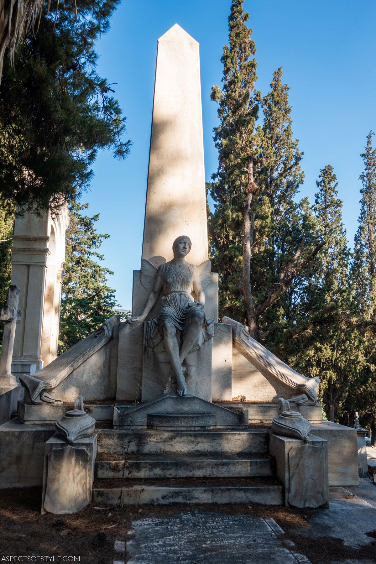 a winged female figure statue on Livieratos family tomb at Athens First Cemetery