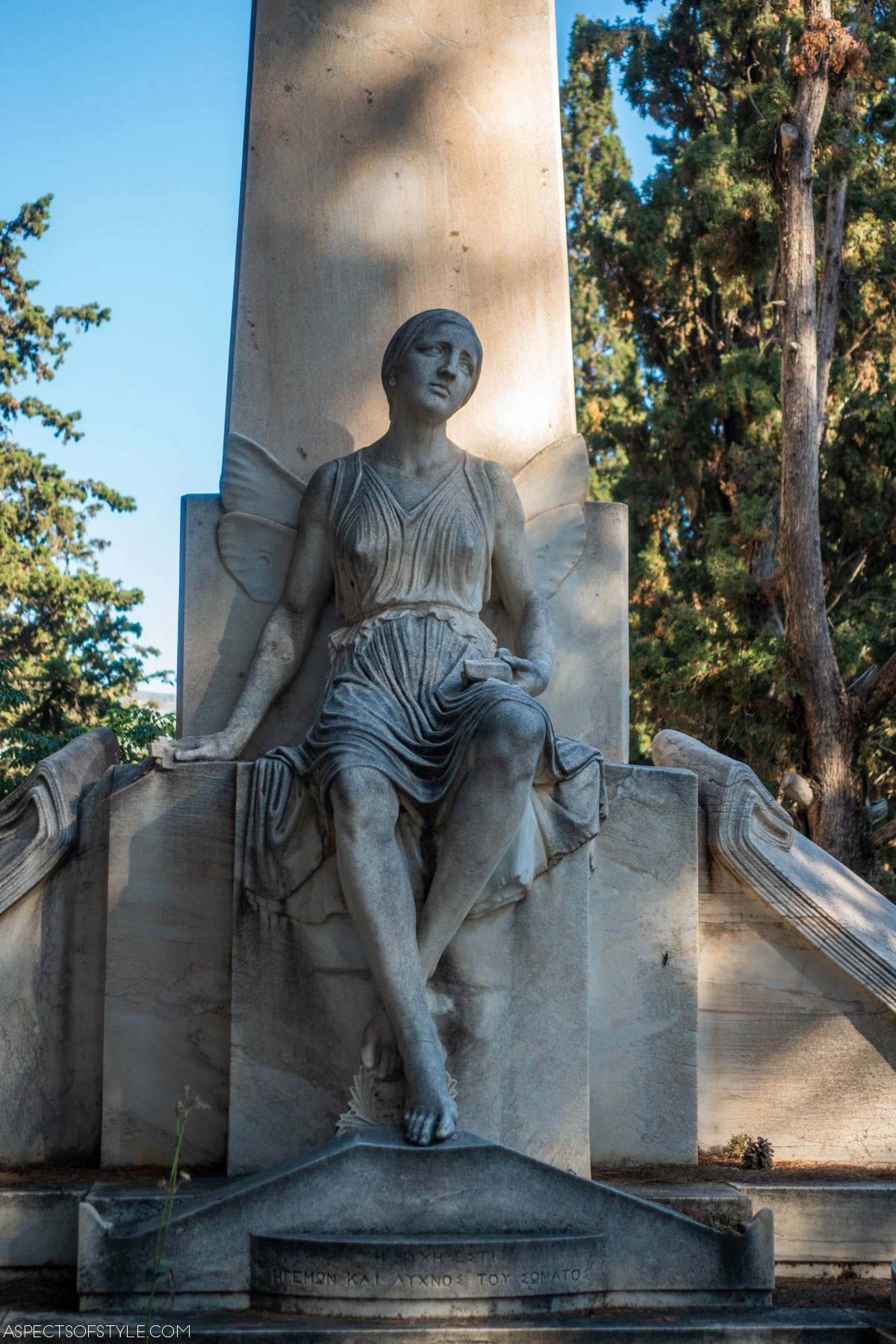 a winged female figure statue on Livieratos family tomb at Athens First Cemetery